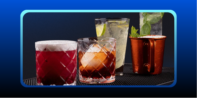 foto mostra uma uma mesa preta com 5 drinks famosos diferentes em cima